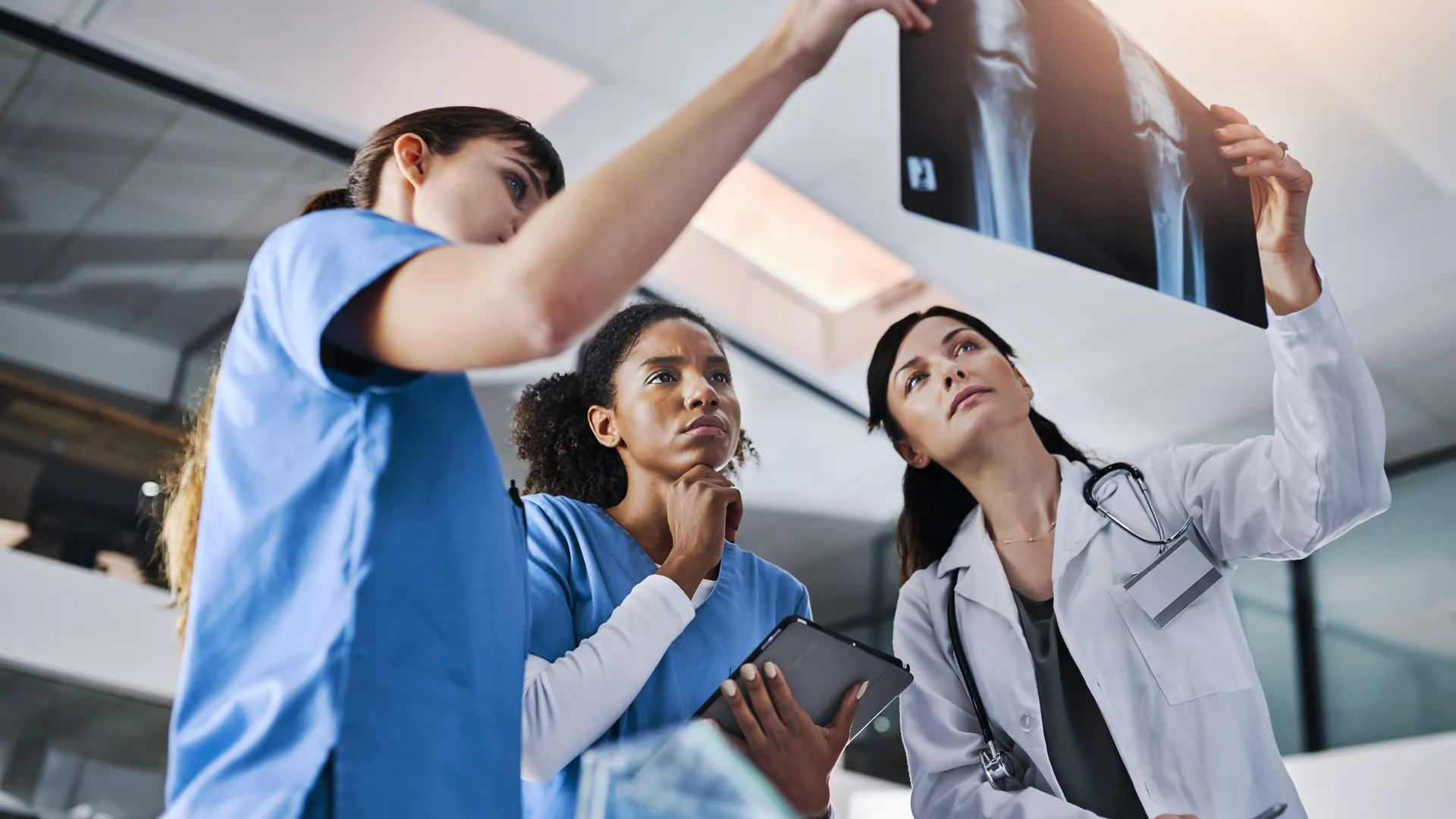 Radiology team reviewing medical images from PACS